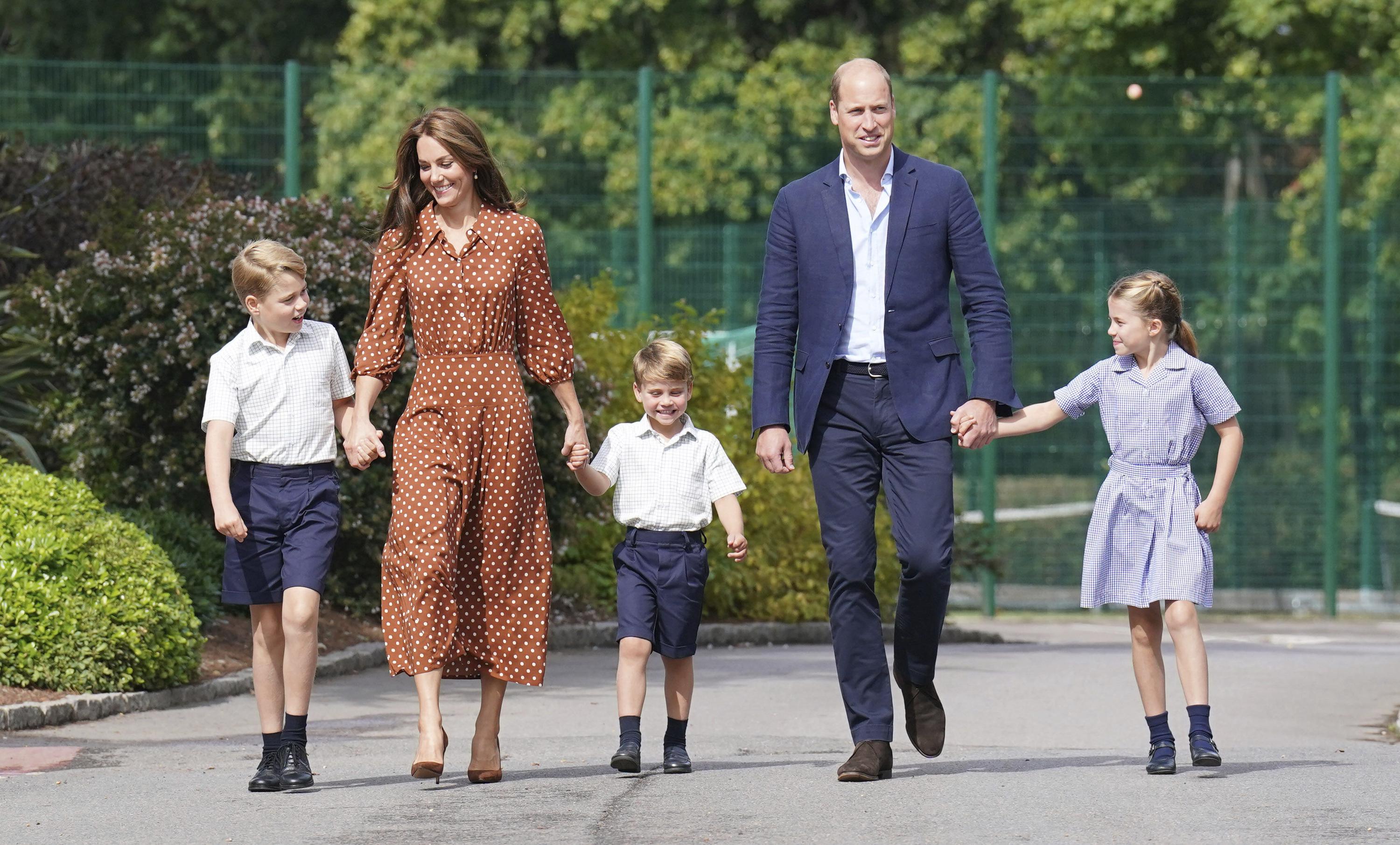 From left, Britain's Prince George, Kate Duchess of Cambridge, Prince Louis, Prince William and Princess Charlotte, arrive for a settling in afternoon at Lambrook School, near Ascot, England, Wednesday, Sept. 7, 2022. The settling in afternoon is an annual event held to welcome new starters and their families to Lambrook and takes place the day before the start of the new school term. (Jonathan Brady/Pool Photo via AP)