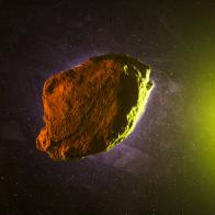 Asteroid rock on green starry background