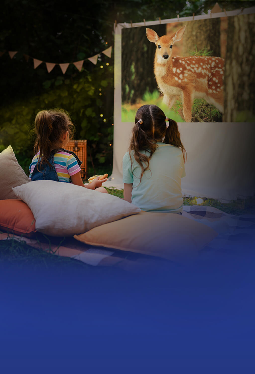 Young girls picnic outside, enjoying an animal related movie content with ASUS ZenBeam L2 smart portable LED projector