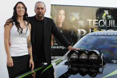 John Paul DeJoria's daughter, Alexis, is a funny car racer. They are shown together at a...