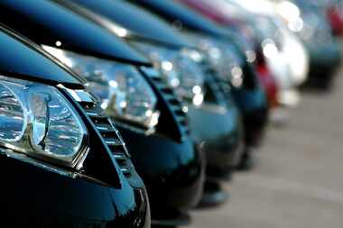 A line of cars at an auto dealership.