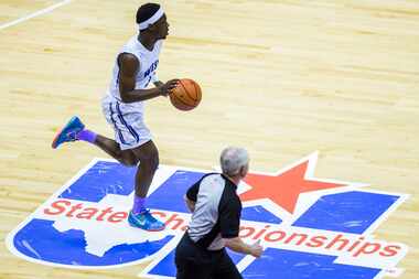 Plano West guard Soso Jamabo (3) dribbles across the UIL logo during their UIL Class 6A...