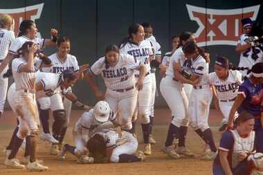 Weslaco players storm the field to congratulate and celebrate with teammate Andrea Ortiz...