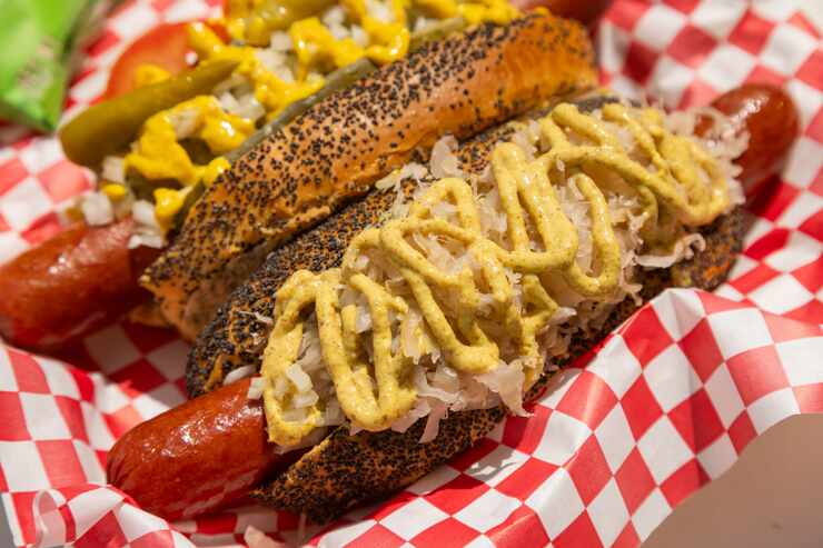 From left, The Chicago Style and N.Y. Style hotdogs served at New York Sub in Dallas on...