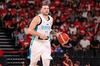 Luka Doncic #77 of Slovenia dribbles the ball during the international basketball game...