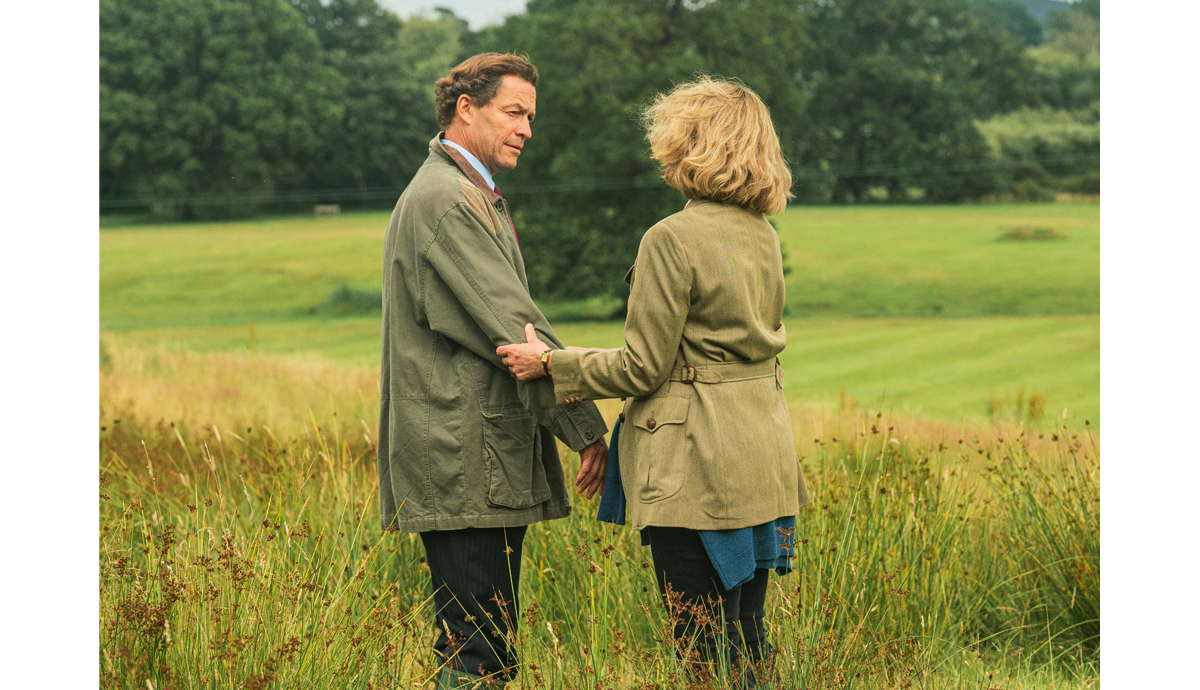 Prince Charles and Camilla standing in a field