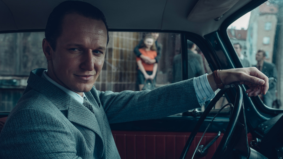 A man sits in a car in ‘The Mire: Millennium’.