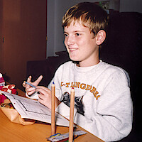 Mats Steen sitting at his desk in 'Ibelin'.