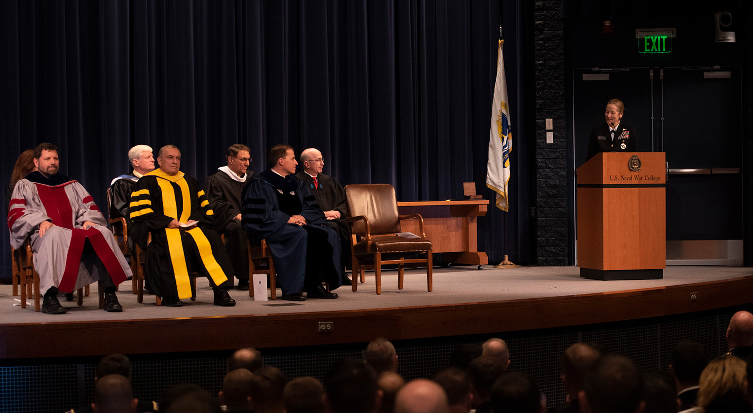 Rear Adm. Shoshana S. Chatfield, president, U.S. Naval War College (NWC), speaks to graduating students during a graduation ceremony in Spruance Auditorium, Nov. 13.