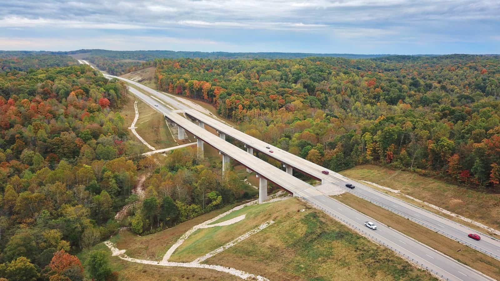 beautiful drone photo of restored bridge with fall foliage