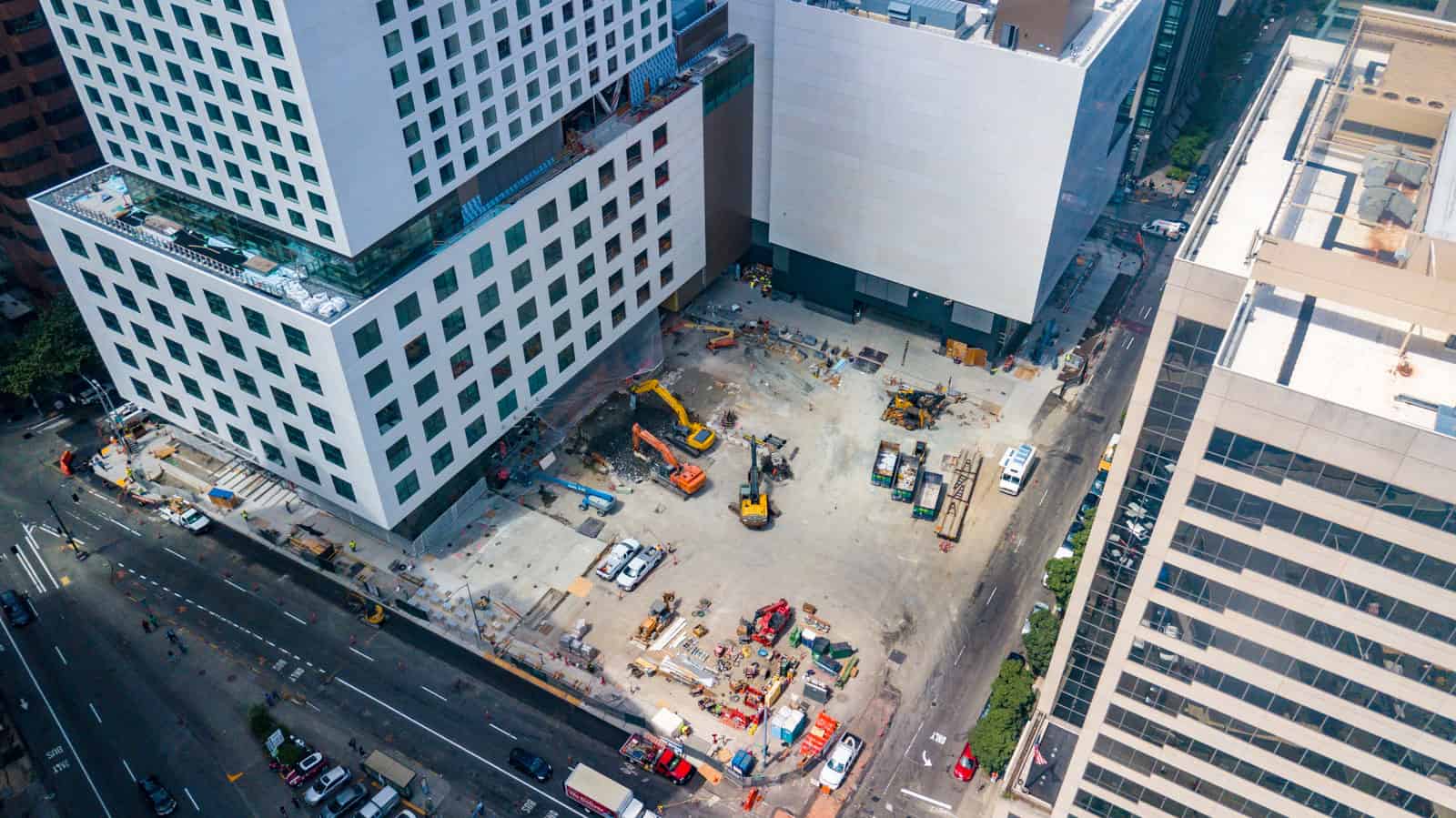 drone photo of construction site at base of skyscraper in Seattle, Washington