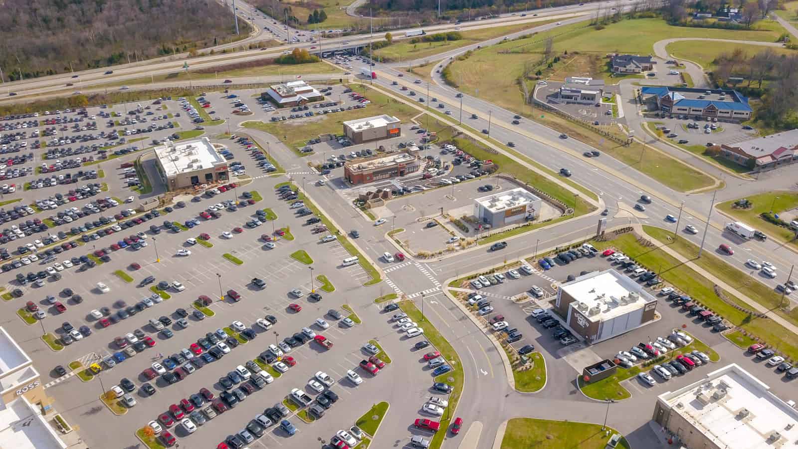 shopping plaza with filled parking lot in Kentucky