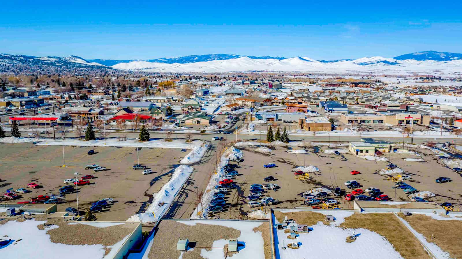 aerial drone photo of Montana with snow and mountains in background