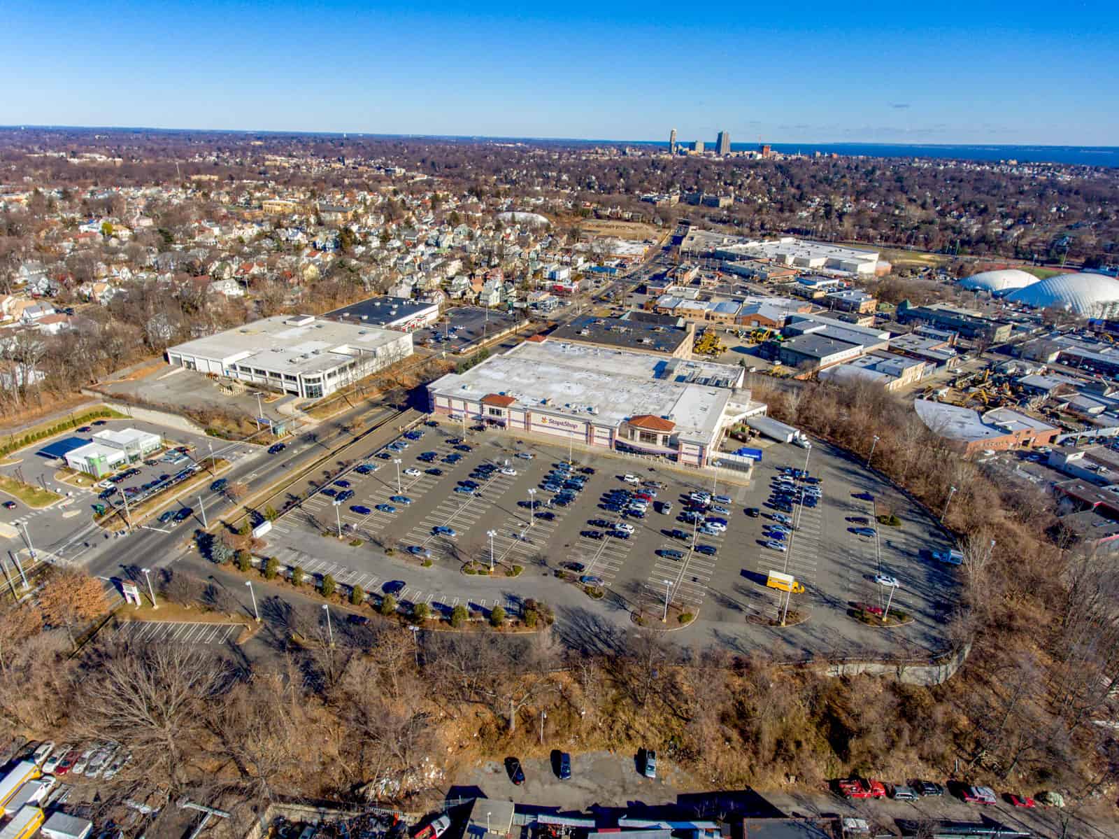 aerial photo of apartment complex with swimming pool in foreground