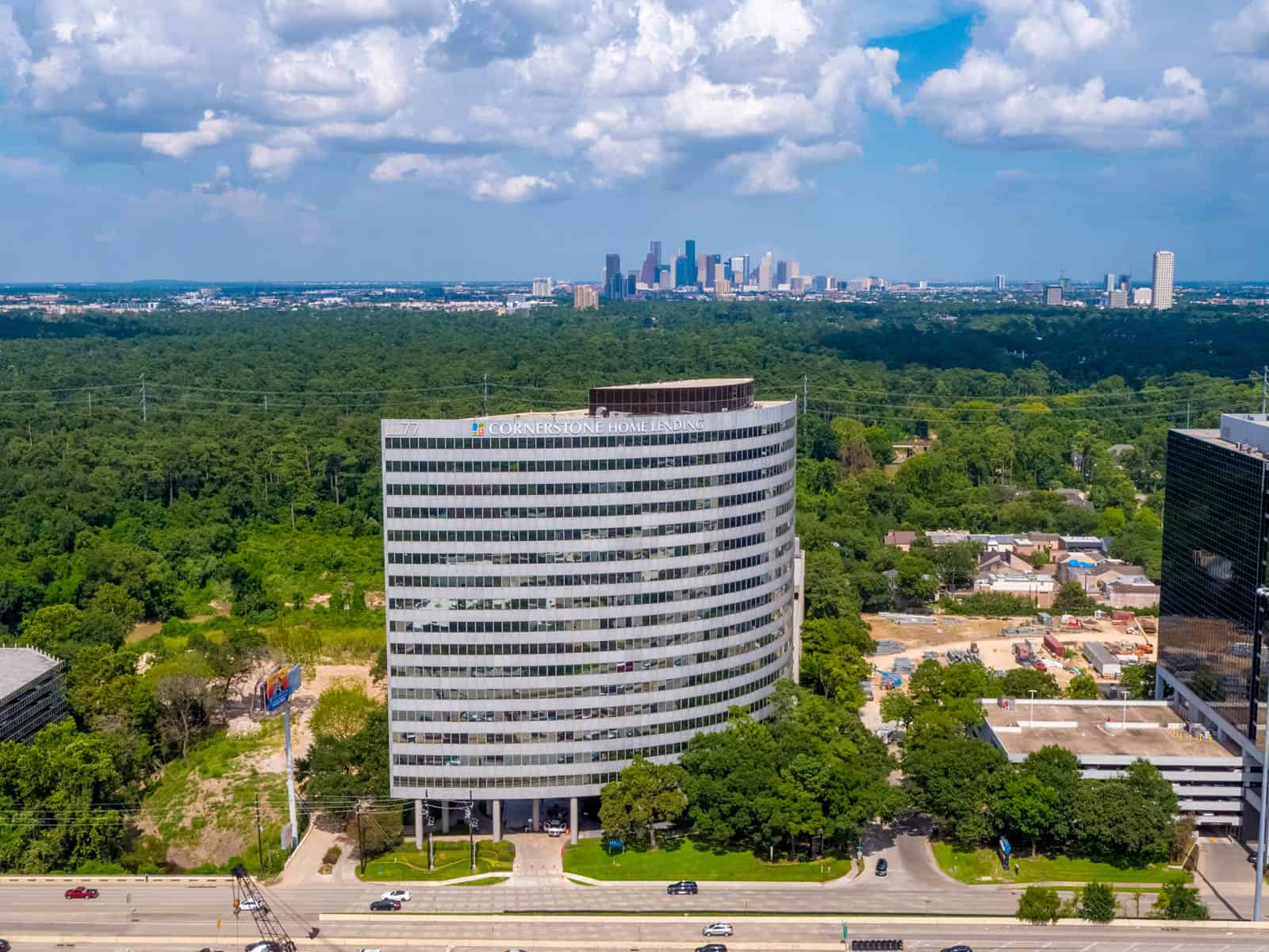 aerial drone photo of newly constructed office building in Texas with city in background