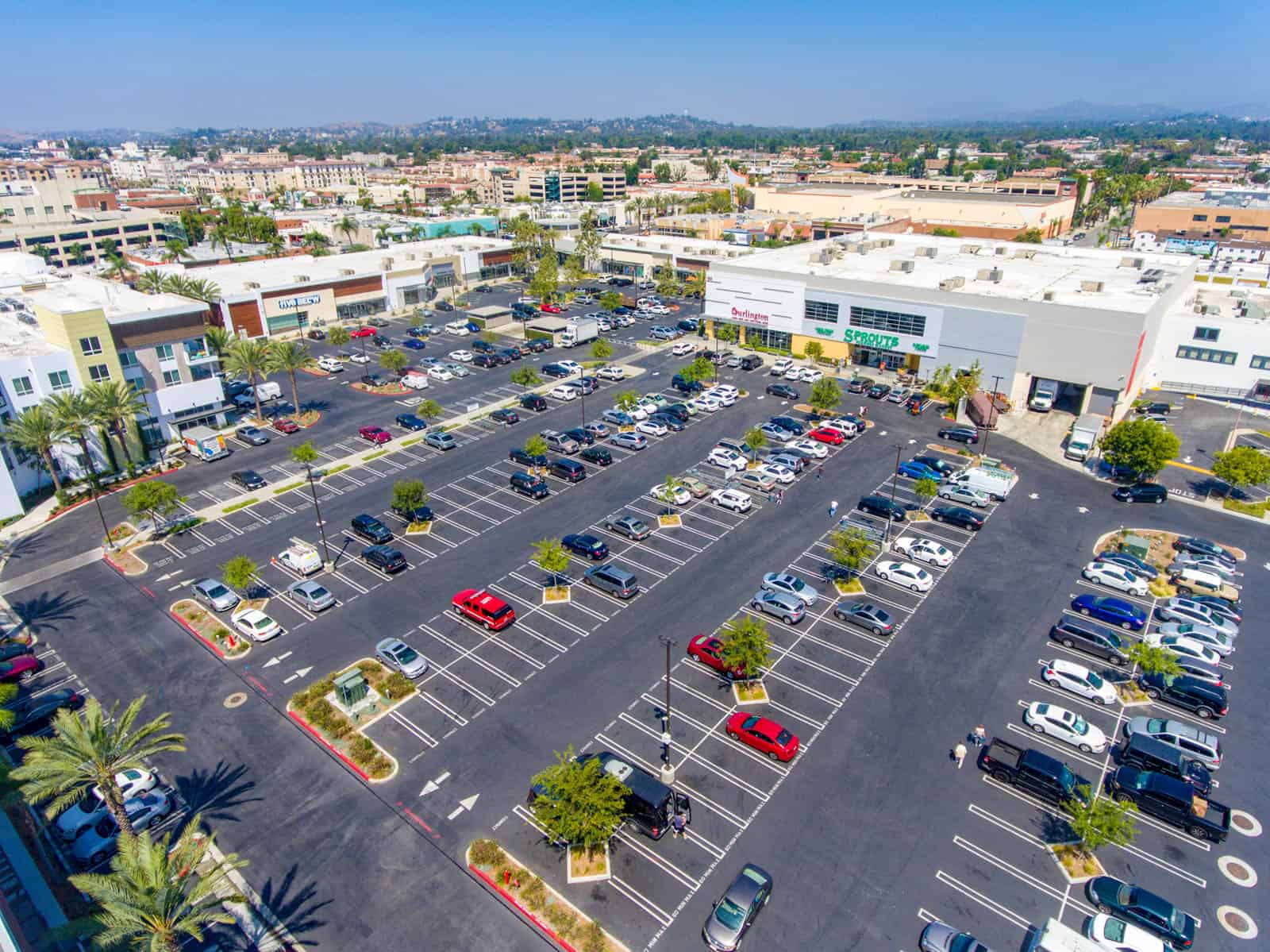 drone photo of shopping plaza and parking lot in Alhambra, CA