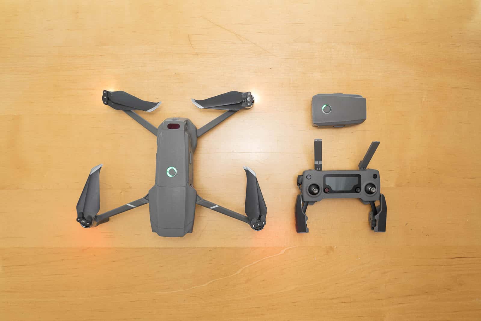 mavic 2 pro drone next to battery and remote controller