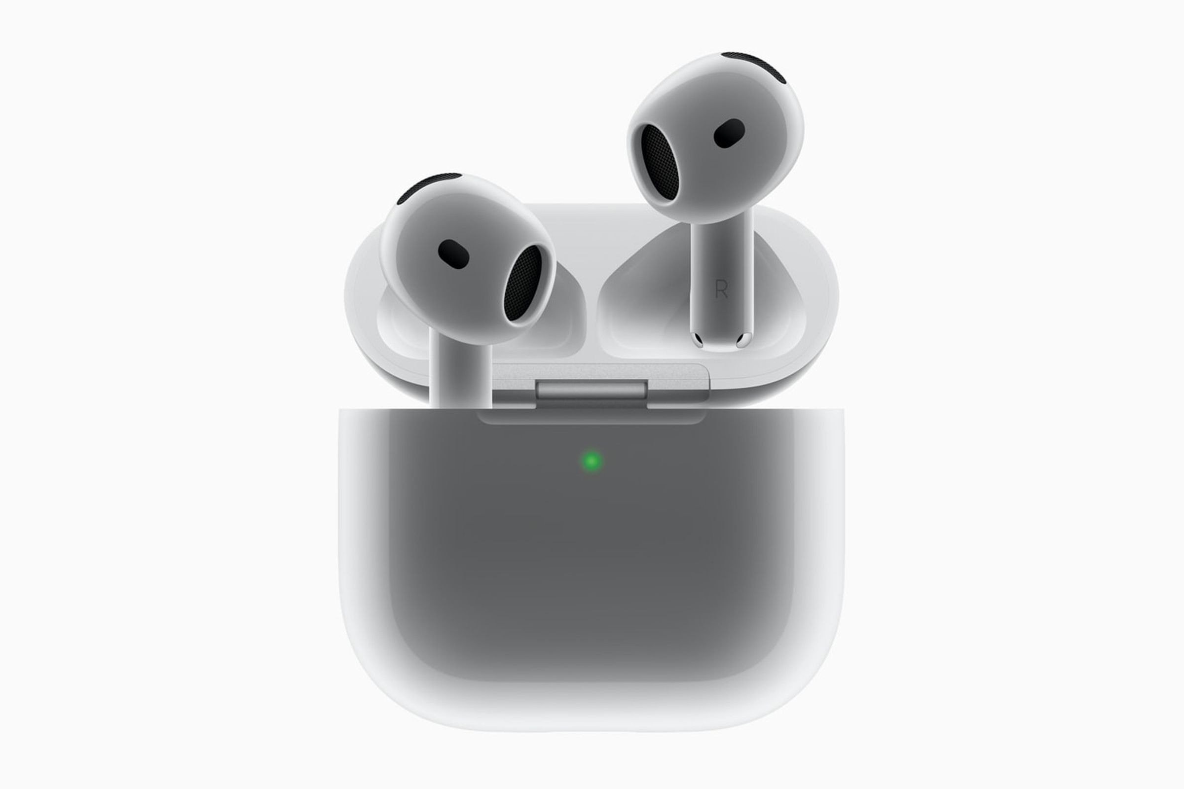 A close-up image of Apple’s AirPods 4 coming out of their case against a gray background.