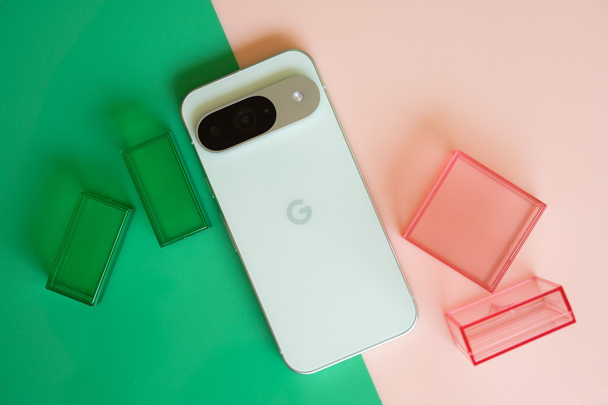 Google Pixel 9 on a pink and green background.