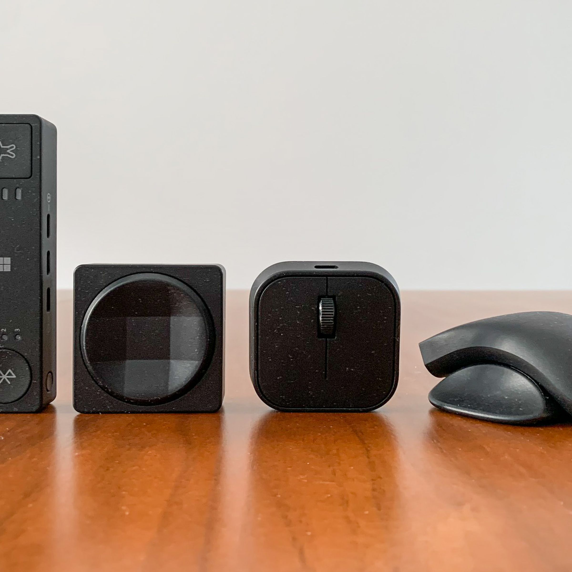 Lineup of Microsoft’s Adaptive Hub, Adaptive D-pad Button (both sides), and Adaptive Mouse with Adaptive Mouse Tail and Thumb Support.