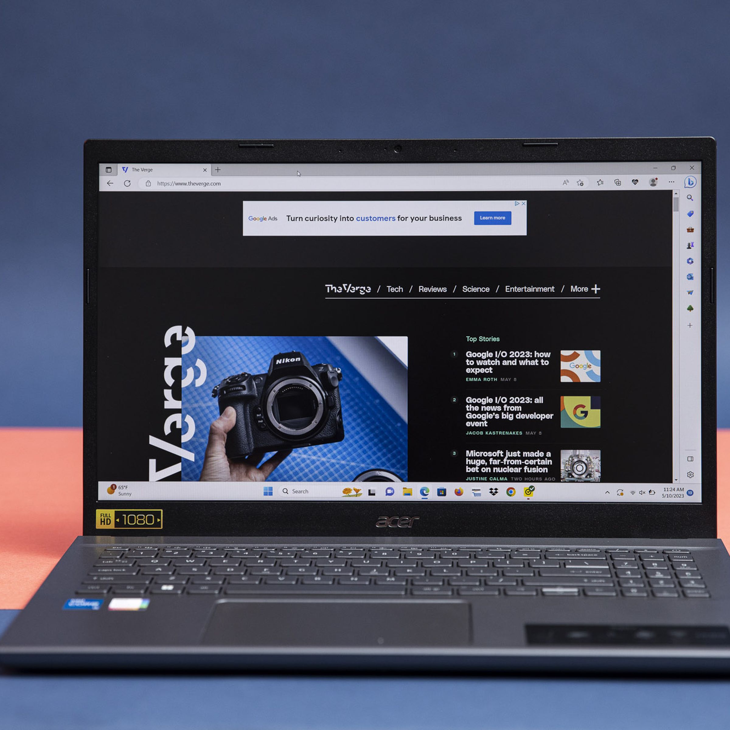 The Acer Aspire 5 displaying The Verge homepage.