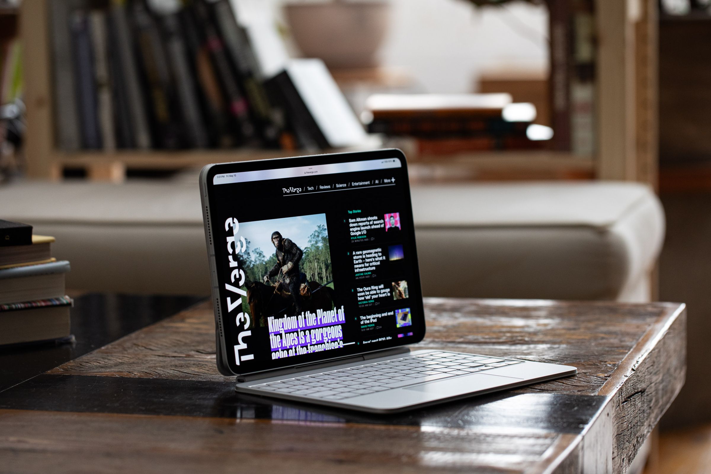 An Apple iPad Pro with a keyboard attached on a desk .