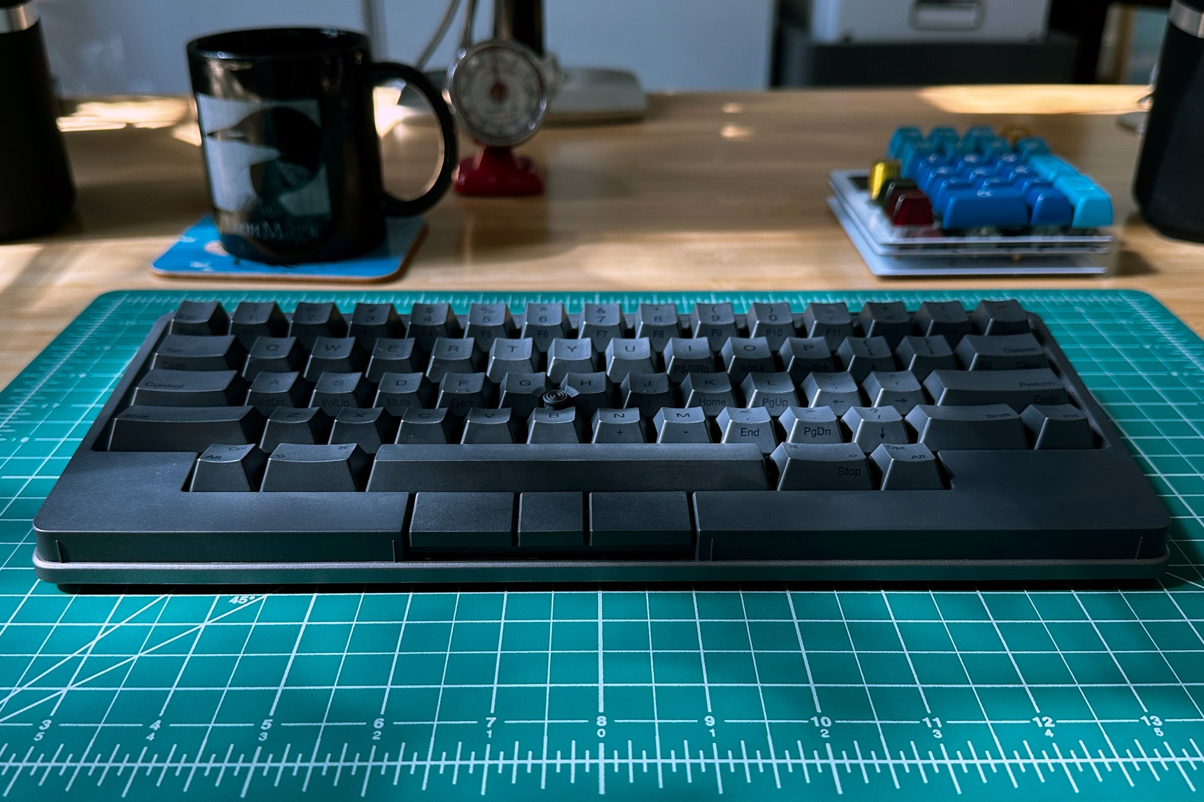 Photo of the HHKB Studio on a green grid background.