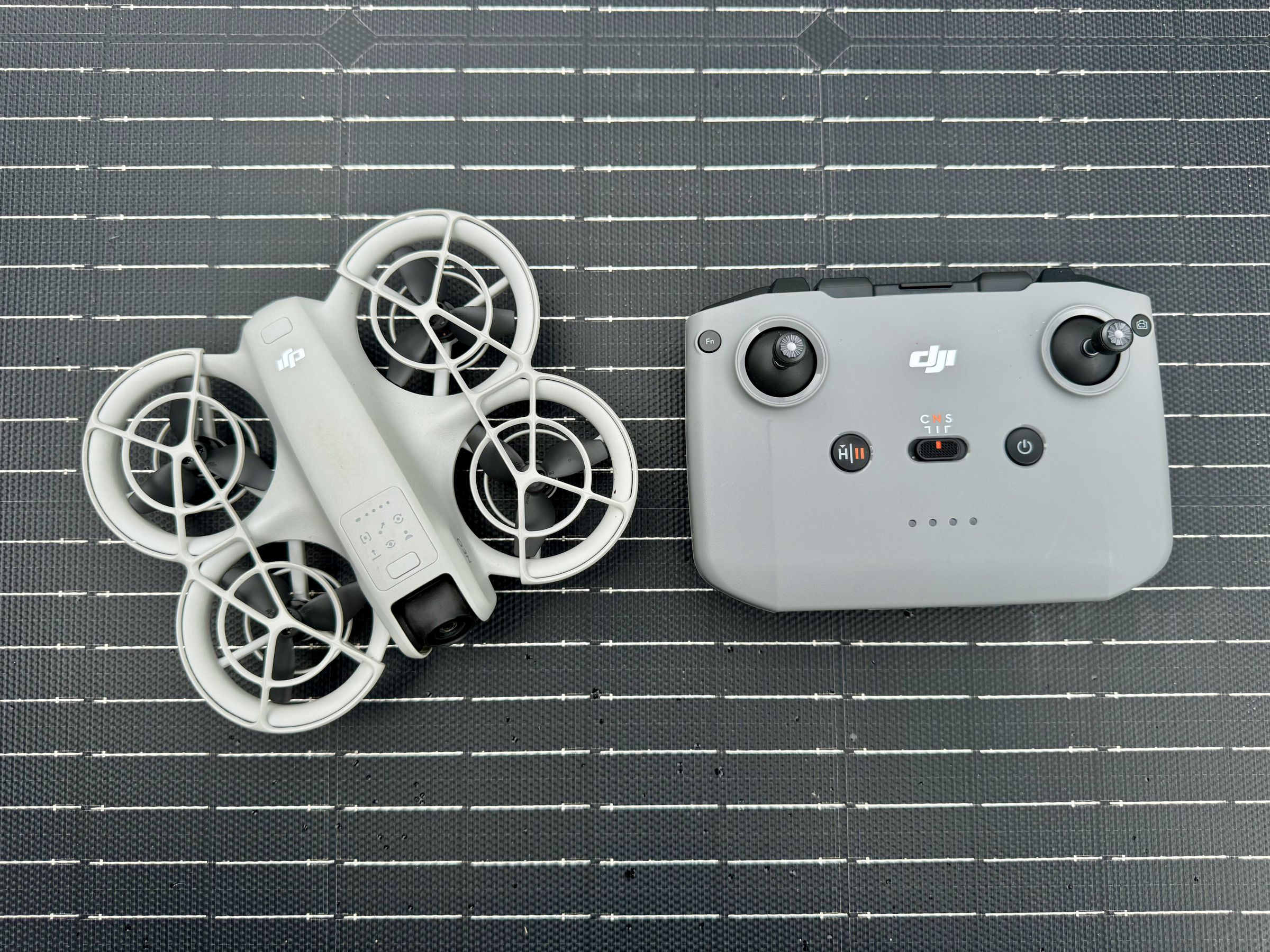 <em>The Neo next to the DJI RC-N3 controller.</em>