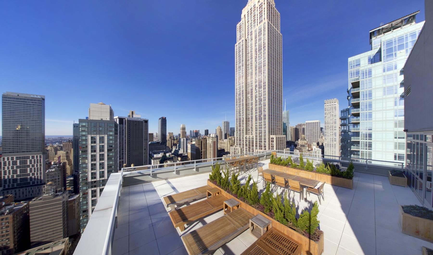 tables and chairs on rooftop terrace