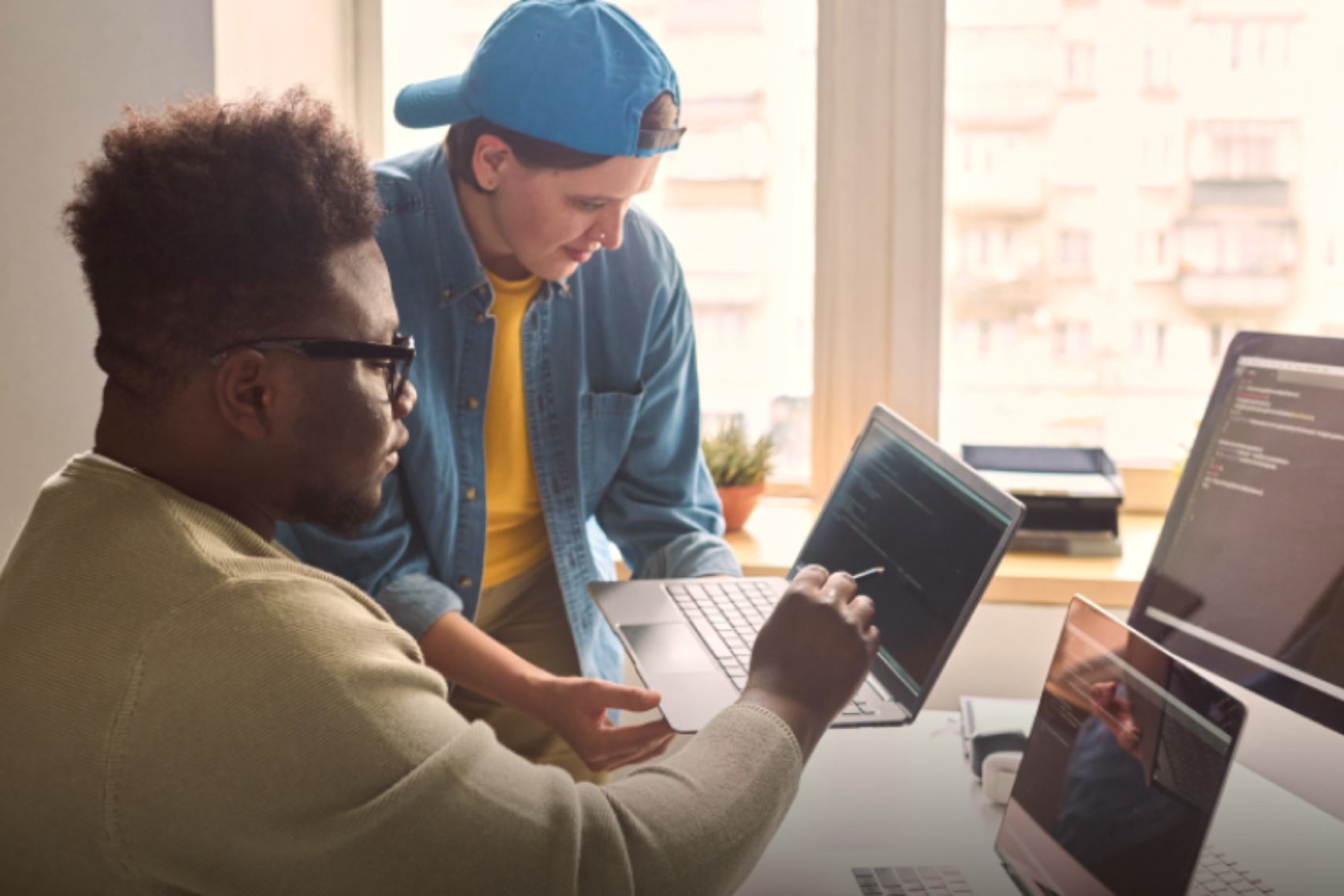 Two men co working in a desk