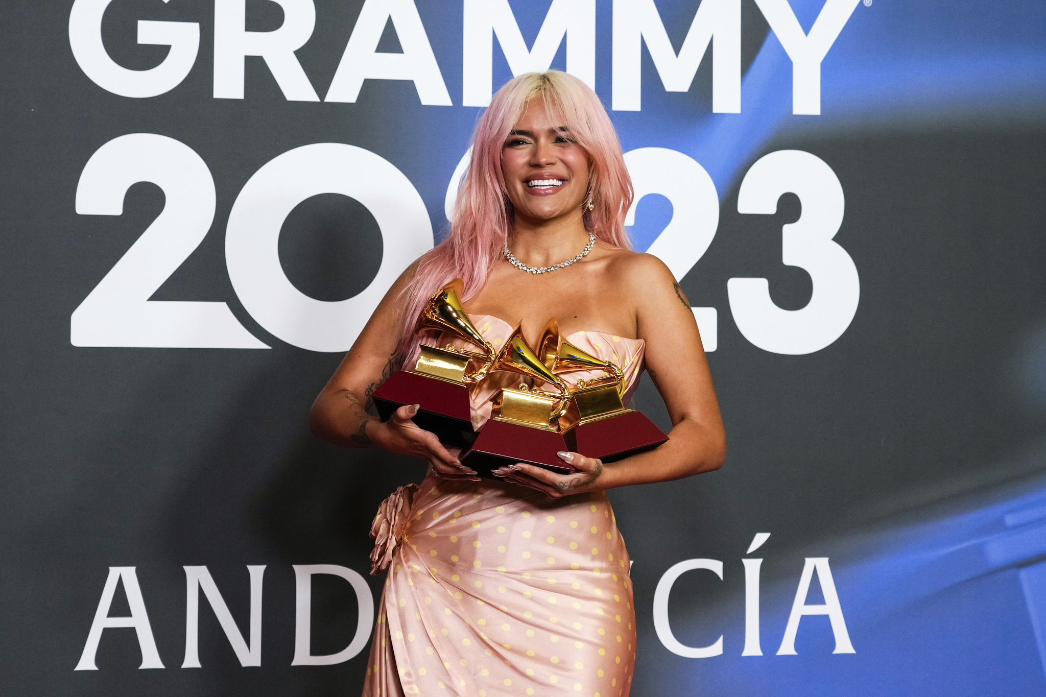 Karol G poses with the awards for best urban album for Ma�ana Sera Bonito.