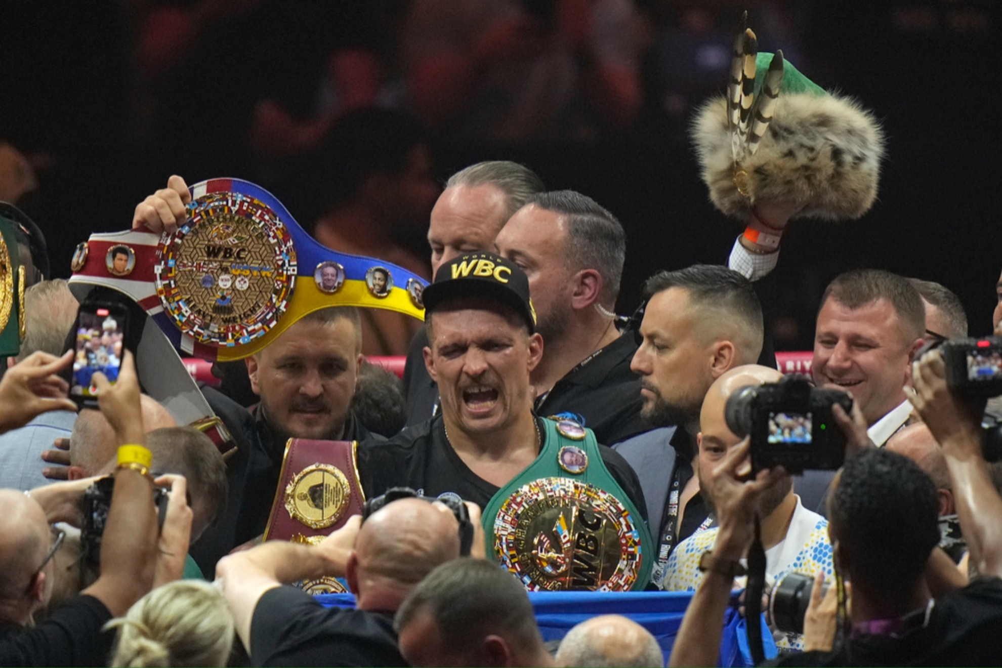 Oleksandr Usyk celebrates after beatingTyson Fury in their undisputed heavyweight world championship boxing fight