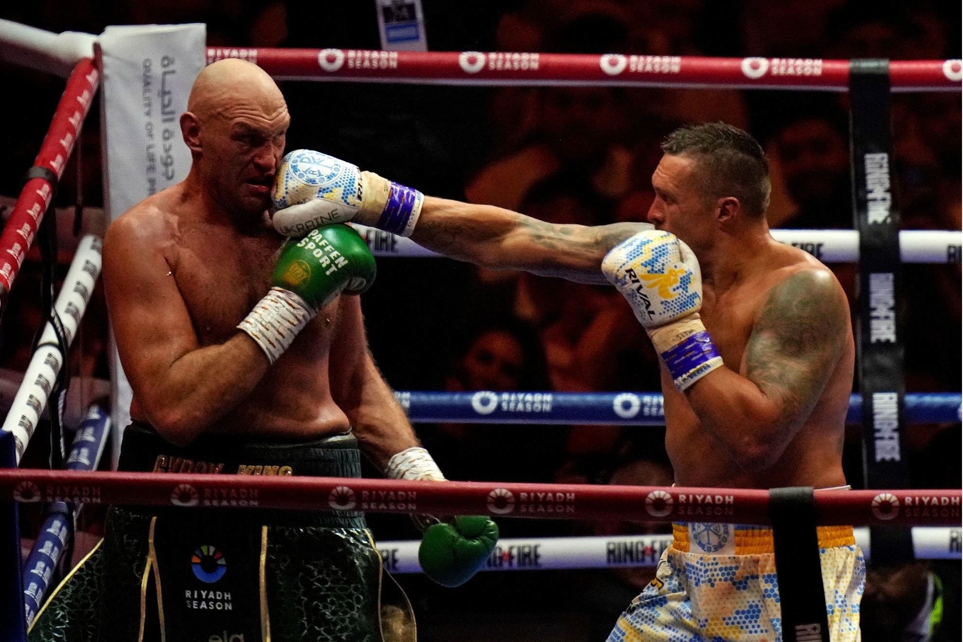 Tyson Fury takes a punch from Oleksandr Usyk.