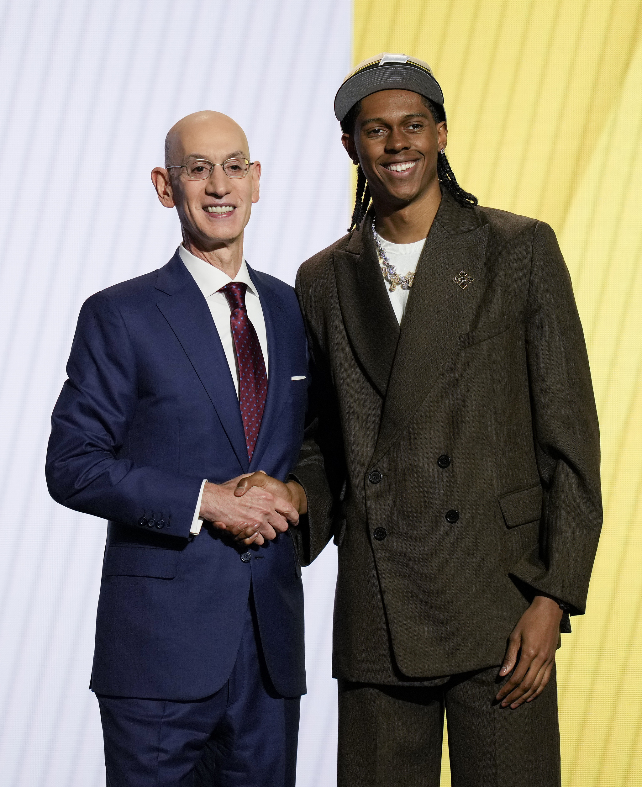 Cody Williams, right, poses for a photo with NBA commissioner Adam Silver after being selected by the Utah Jazz as the 10th pick