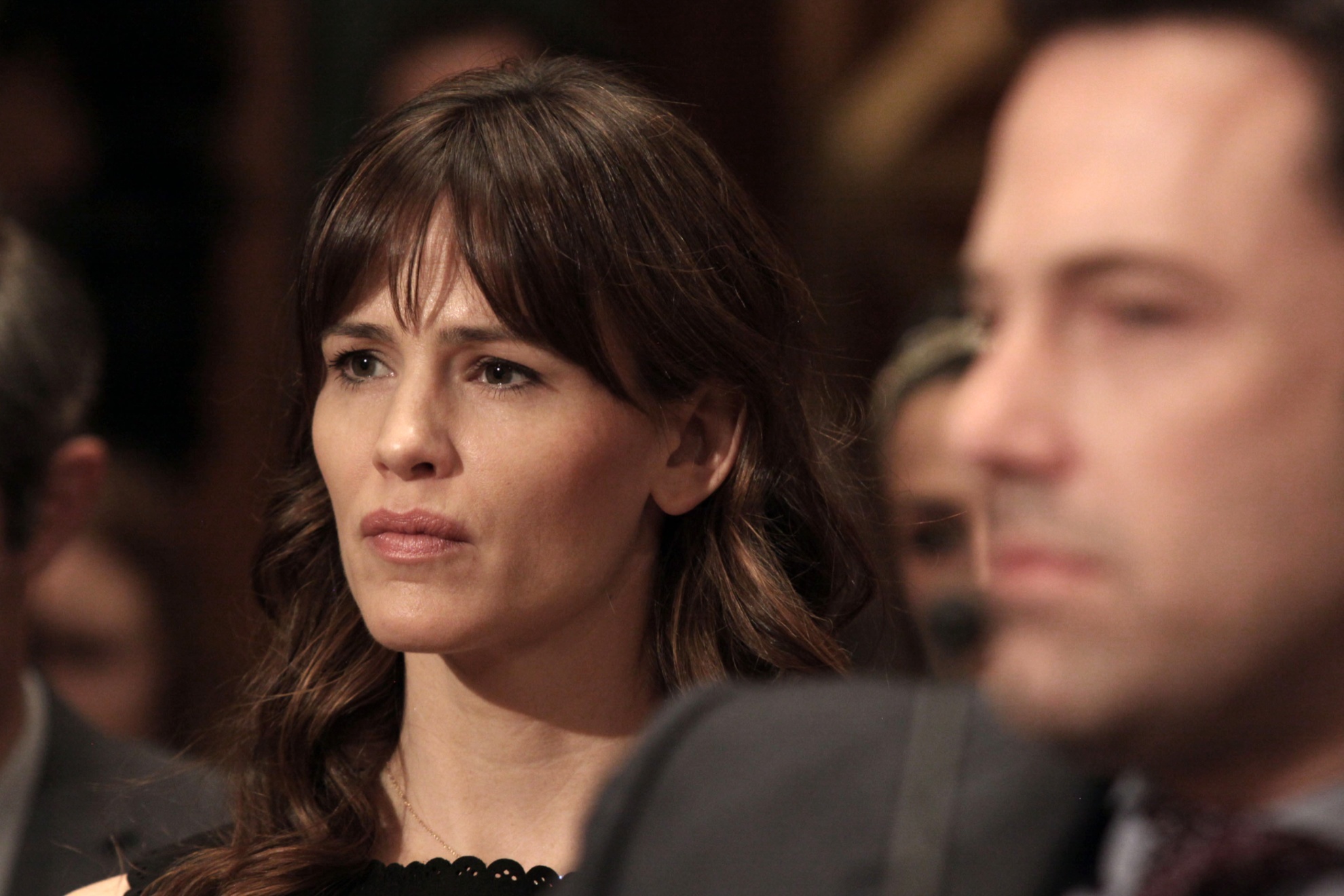Actress Jennifer Garner listens to testimony on Capitol Hill in Washington, Thursday, March 26, 2015, during a Senate State, Foreign Operations, and Related Programs subcommittee hearing on diplomacy, development and national security, where her husband, Ben Affleck, right, testified. (AP Photo/Lauren Victoria Burke)