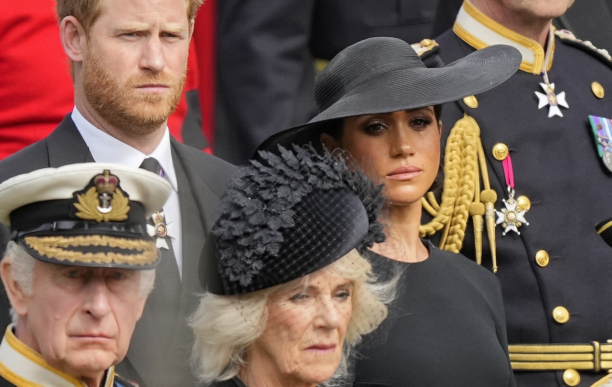 Britains King Charles III, from bottom left, Camilla, the Queen Consort, Prince Harry and Meghan, Duchess of Sussex watch the coffin of Queen Elizabeth II