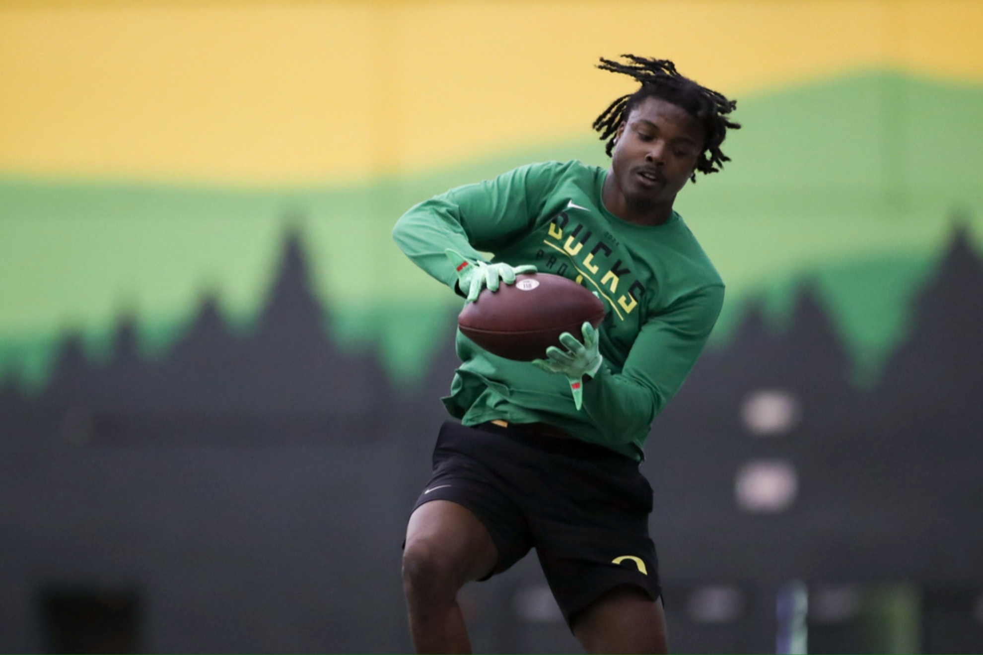 Khyree Jackson participating in a position drill at Oregons NFL Pro Day.