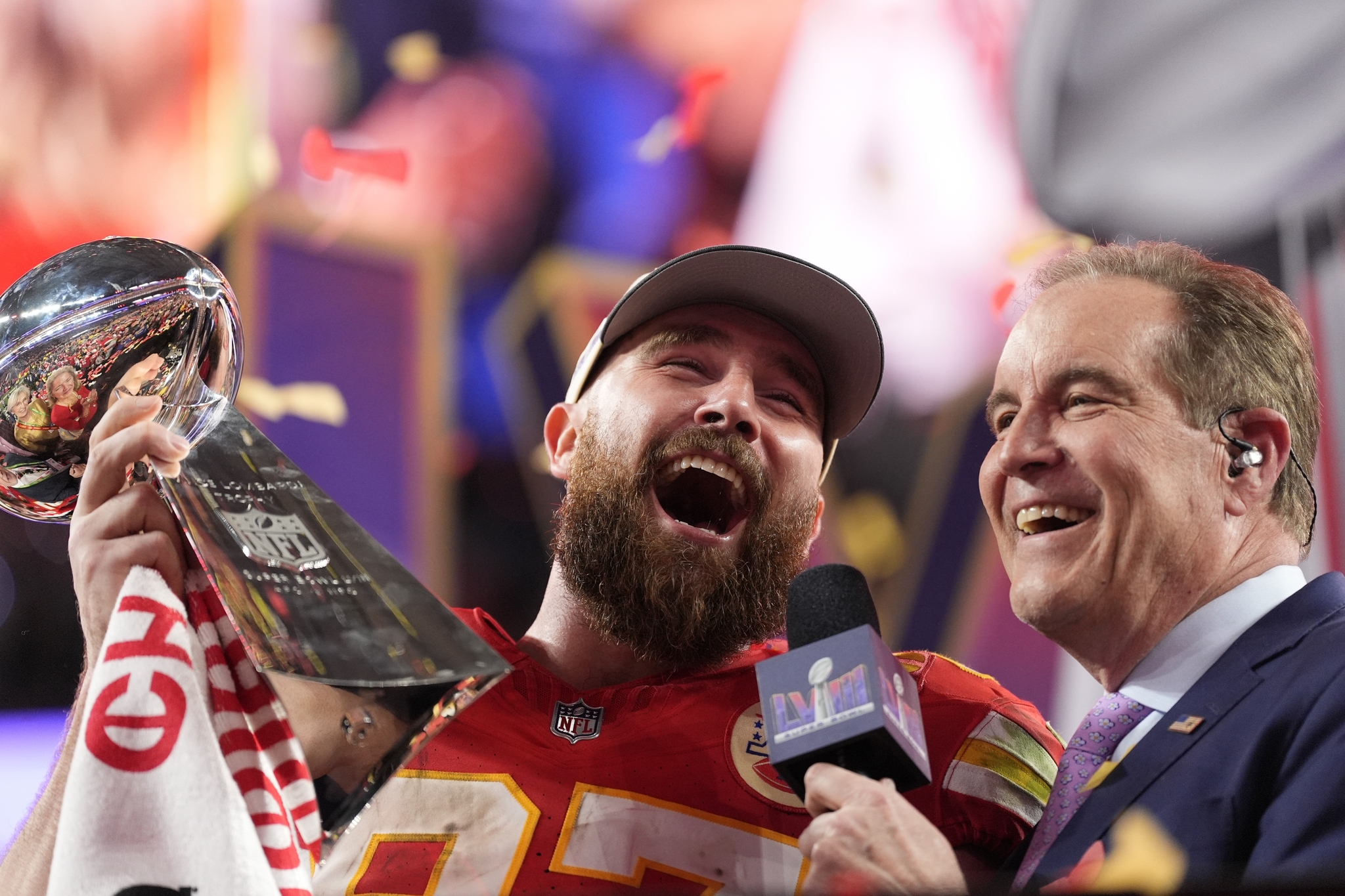 Kansas City Chiefs tight end Travis Kelce (87) celebrates while holding the Vince Lombardi Trophy