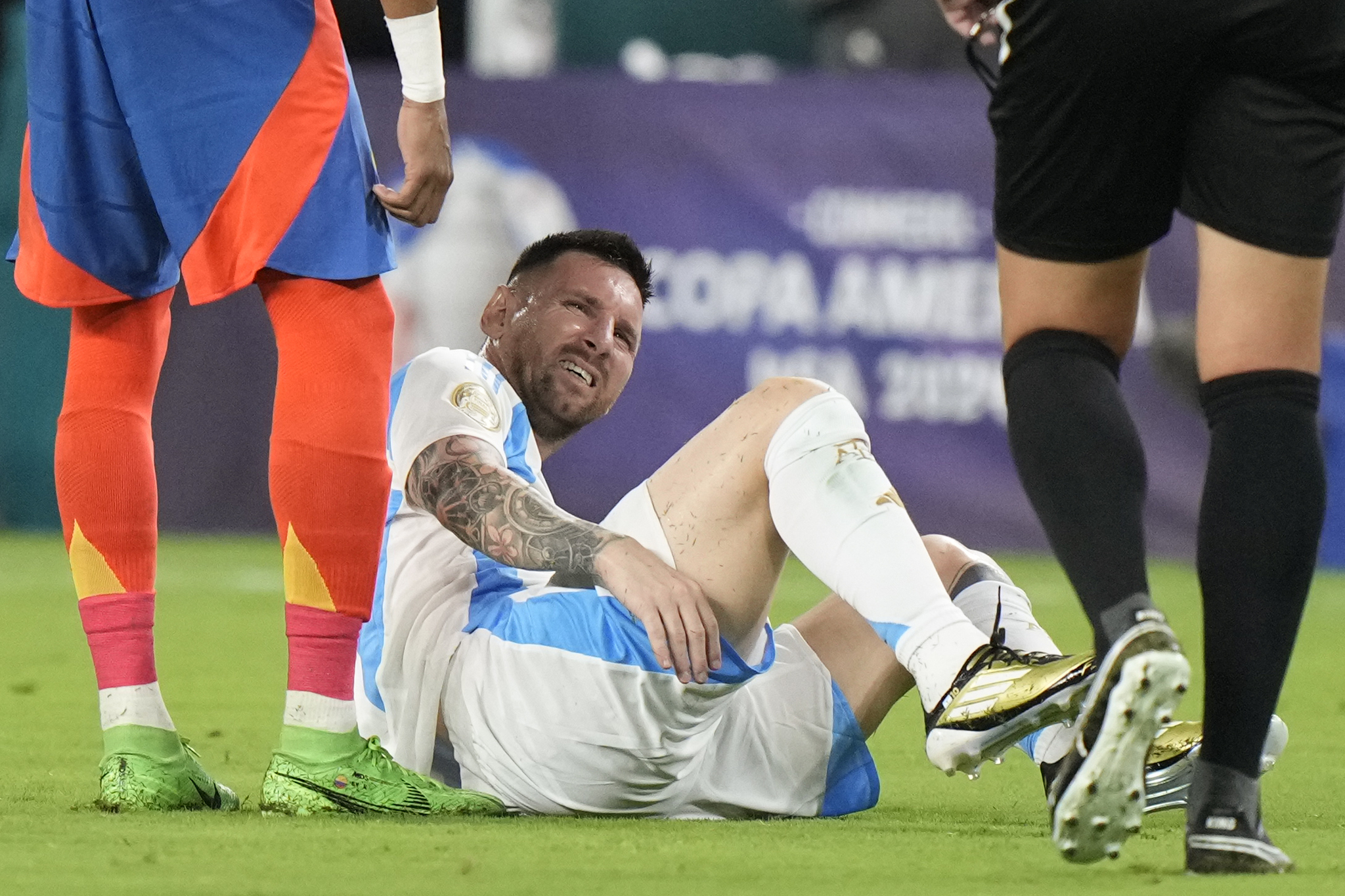 Messi suffering an injury during the final of the Copa America