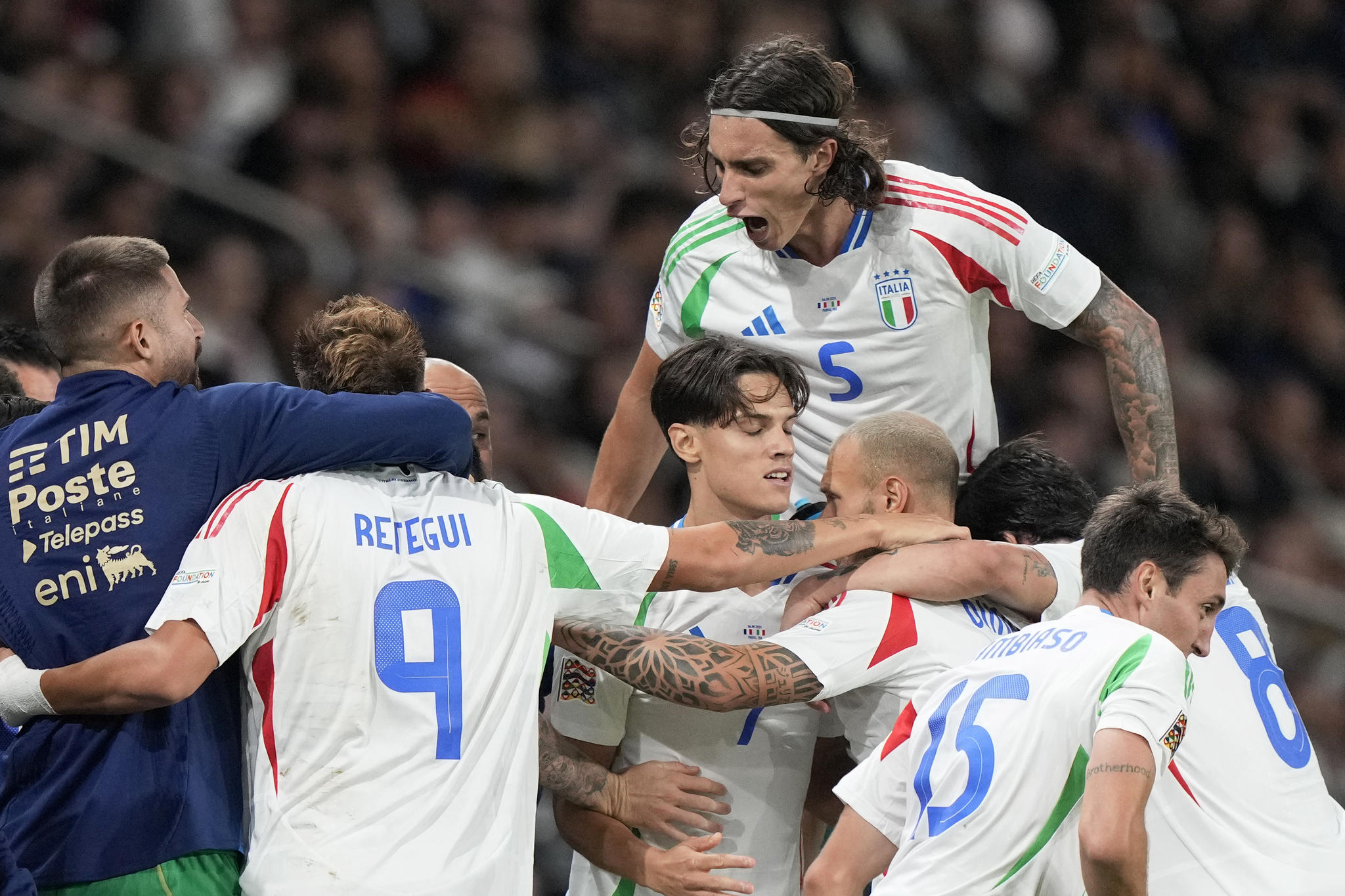 Italy players celebrate after scoring their second goal