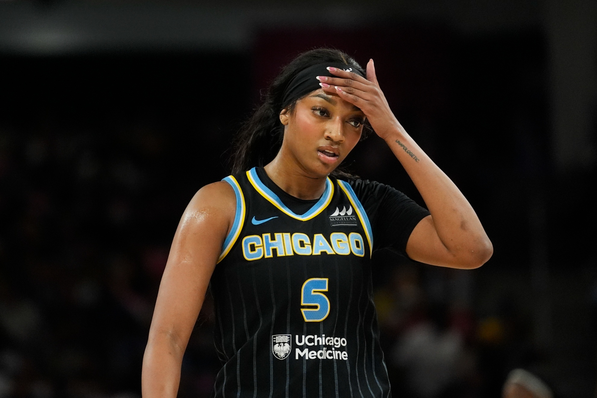 Chicago Sky forward Angel Reese wipes her brow during the first half of a WNBA basketball game against the Indiana Fever, Friday, Aug. 30, 2024, in Chicago. (AP Photo/Erin Hooley)