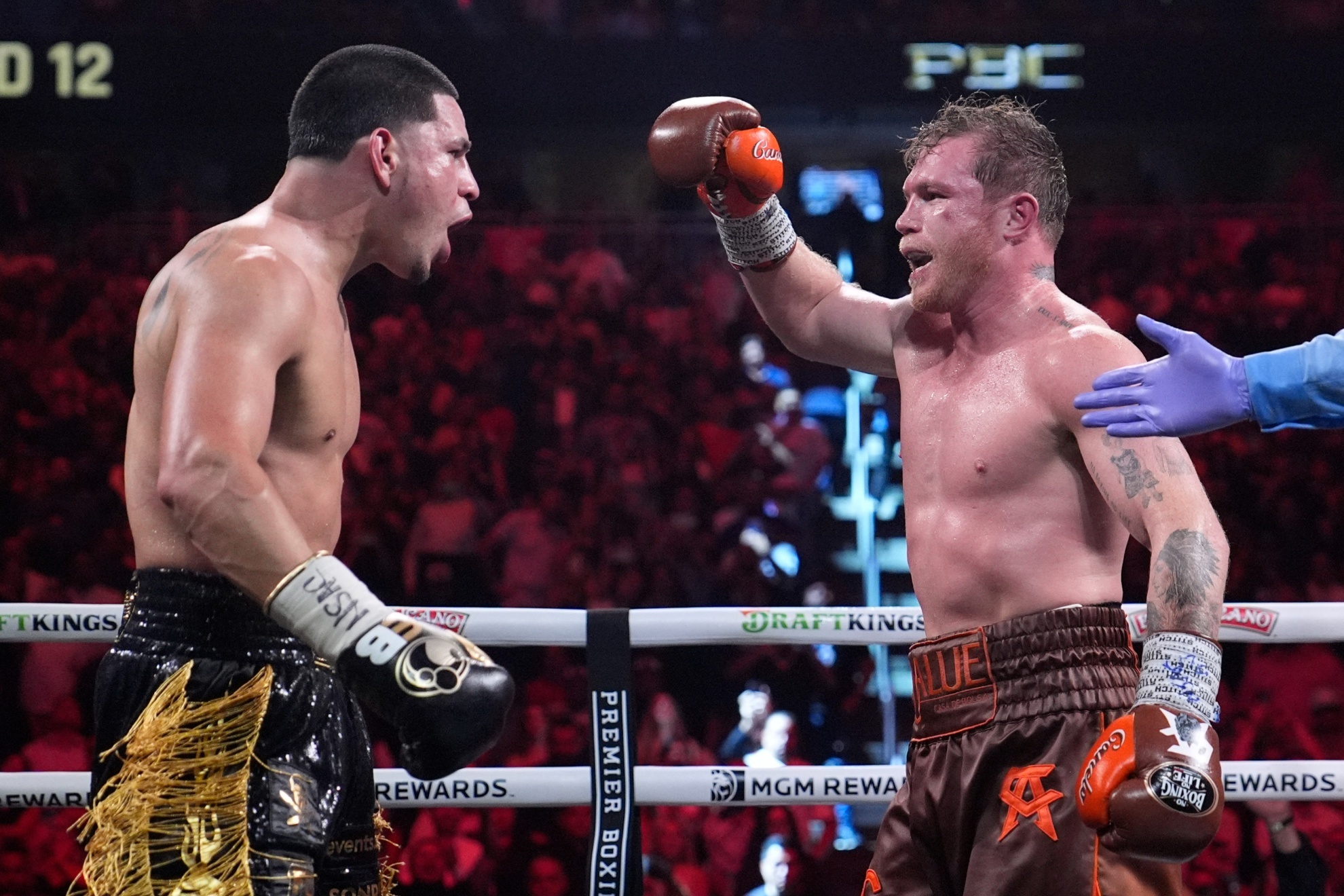 Canelo Alvarez, right, and Edgar Berlanga react after their super middleweight title bout Saturday, Sept. 14, 2024, in Las Vegas. (AP Photo/John Locher)