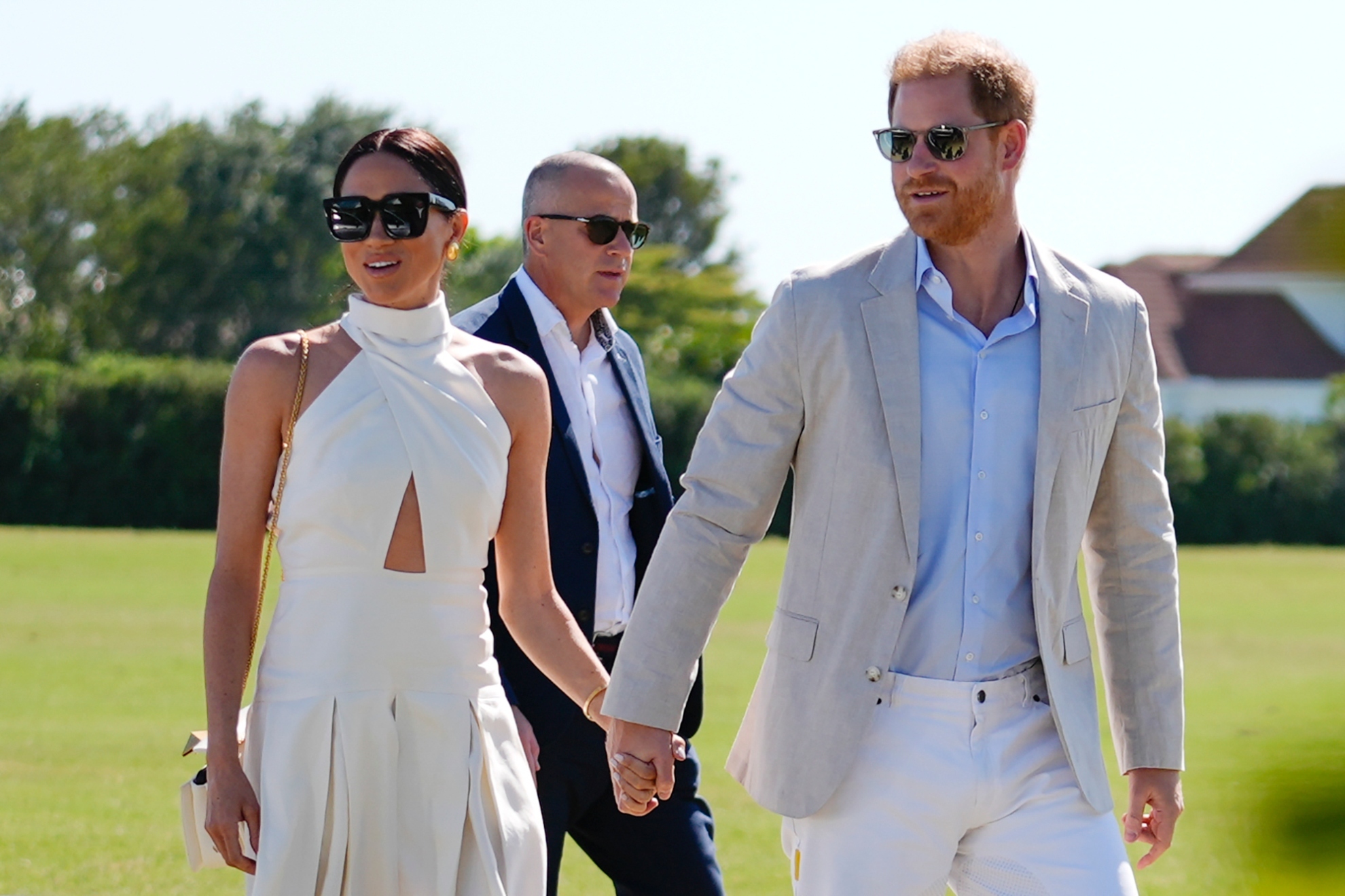 Britains Prince Harry, right, and wife Meghan Markle, Duchess of Sussex, arrive for the 2024 Royal Salute Polo Challenge to Benefit Sentebale, Friday, April 12, 2024, in Wellington, Fla.