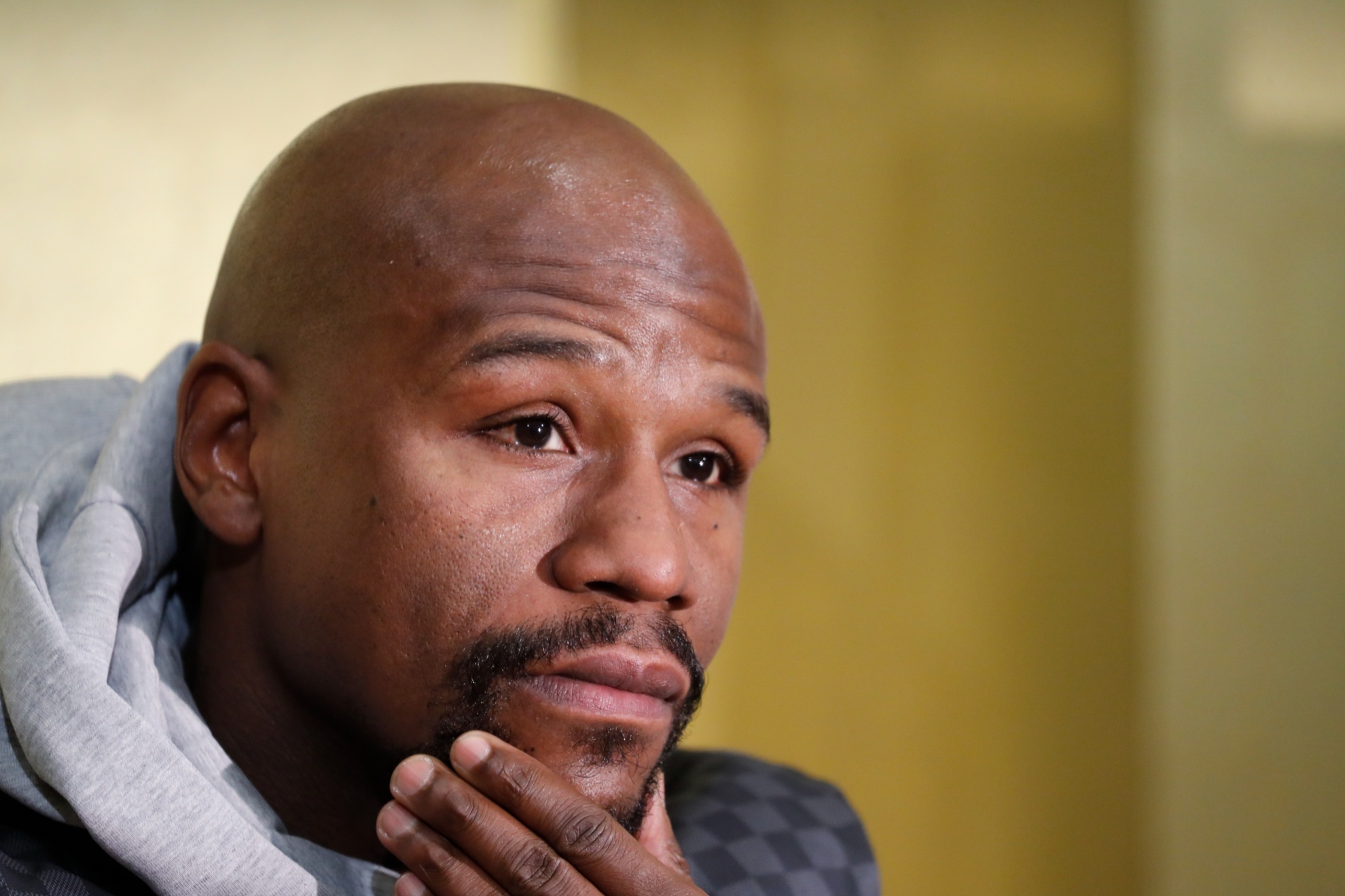 Floyd Mayweather Jr. listens questions from media during a news conference in Tokyo Saturday, Dec. 29, 2018. Mayweather is scheduled to fight Japanese kickboxer Tenshin Nasukawa in a three-round exhibition match in Japan on New Years Eve. (AP Photo/Eugene Hoshiko)