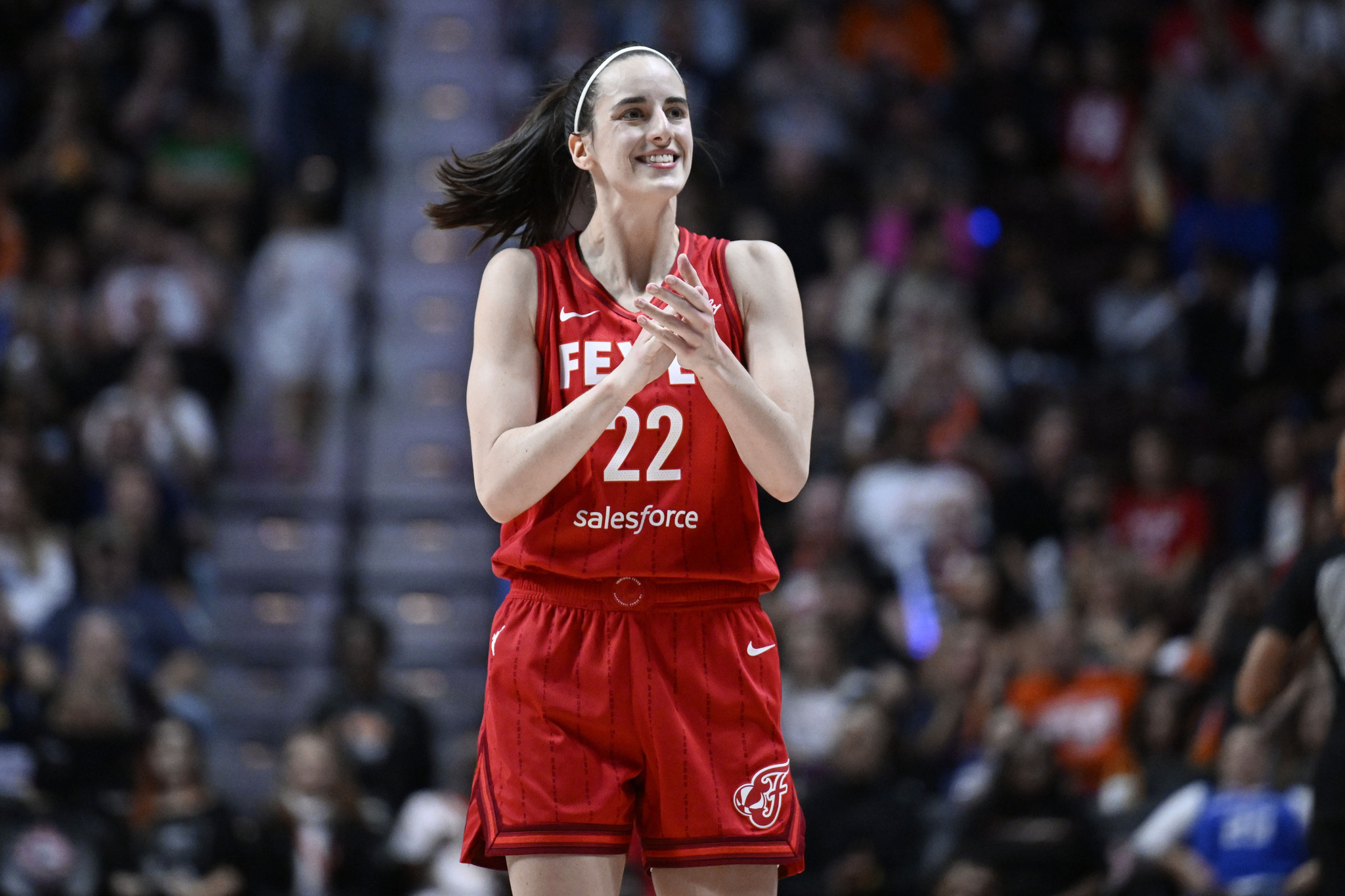 Indiana Fever guard Caitlin Clark (22) reacts during a first-round WNBA basketball playoff game against the Connecticut Sun