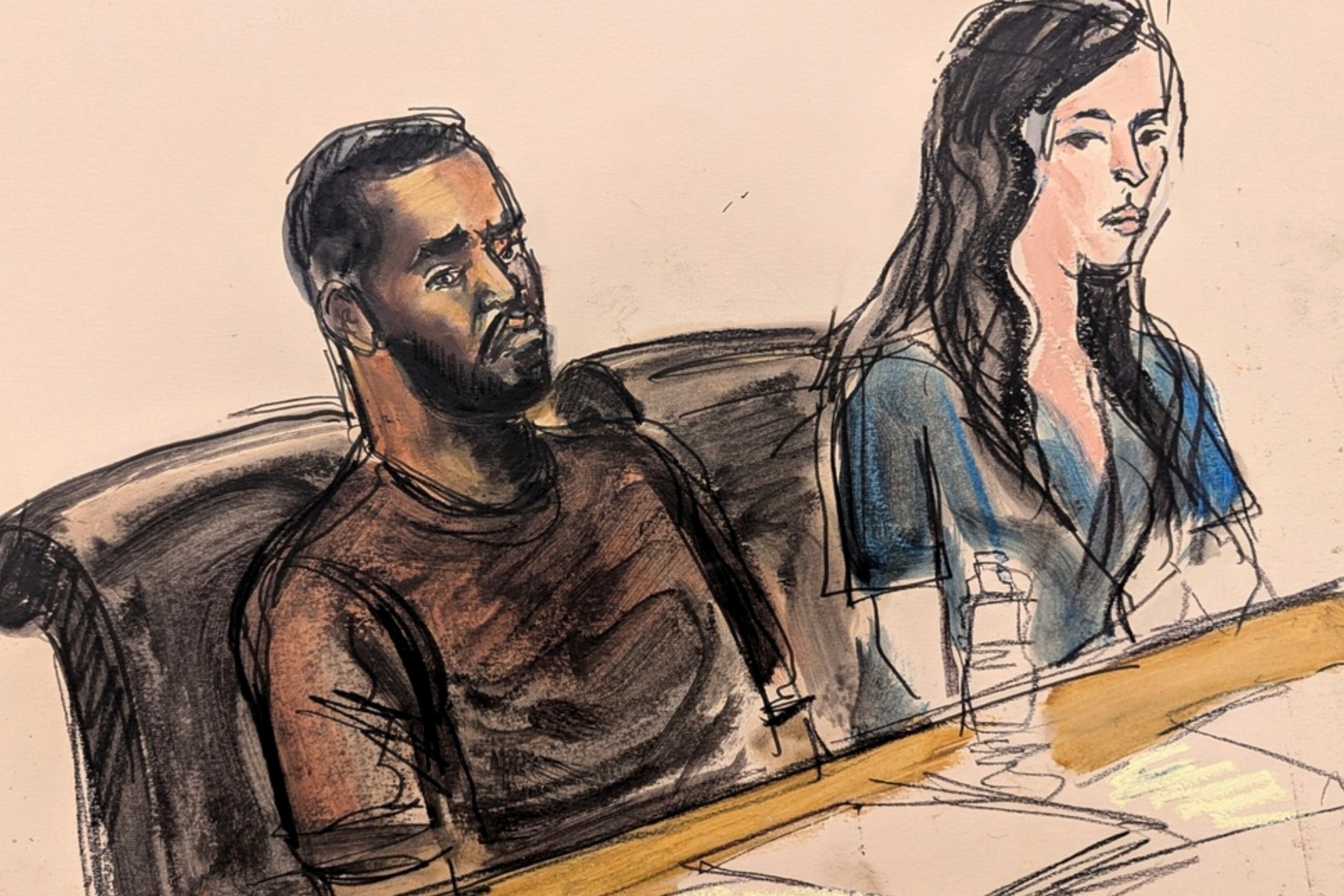 Sean Diddy Combs, left, sits at the defense table during his bail hearing on Sept. 18, 2024