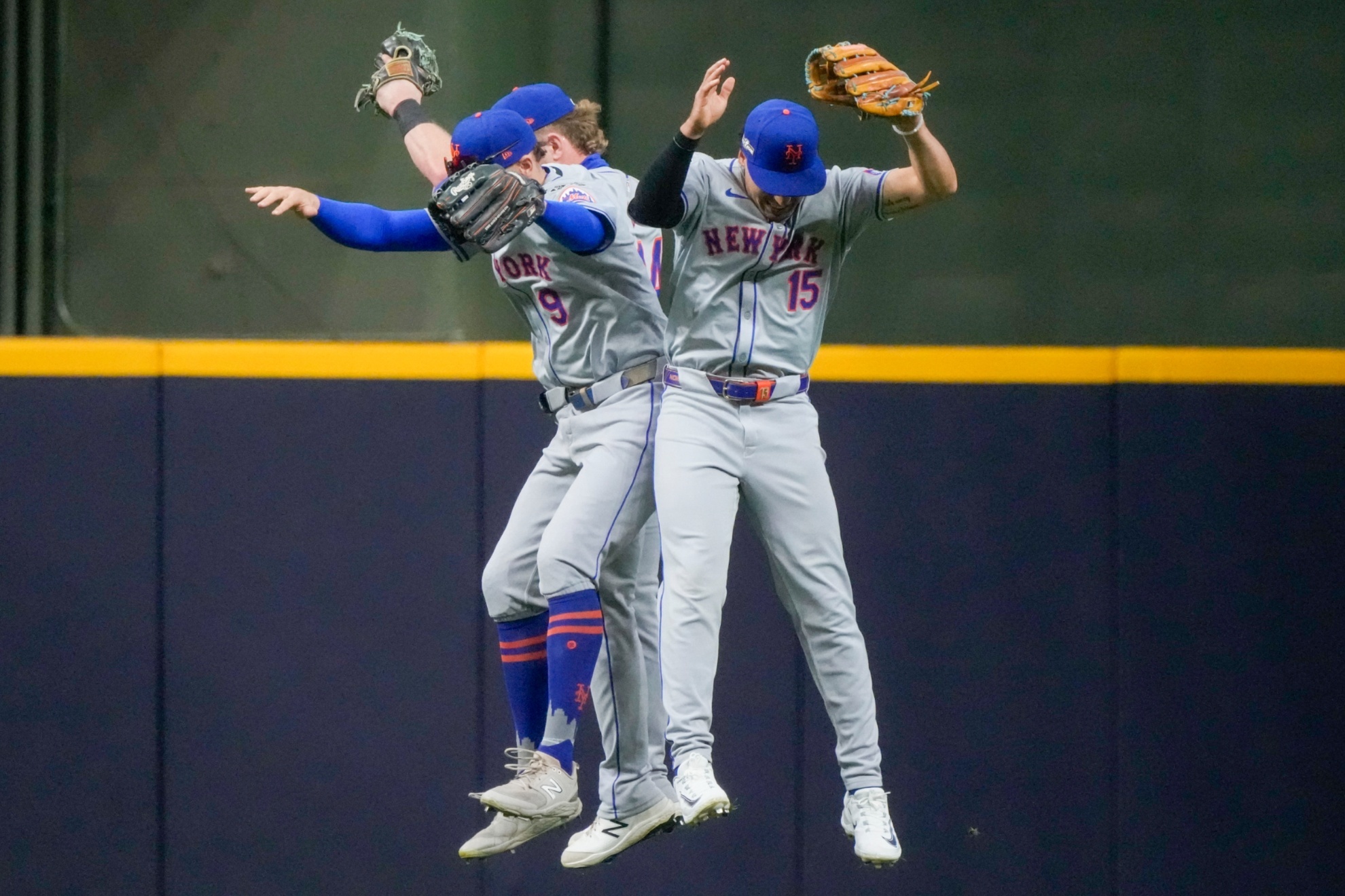 New York Mets Brandon Nimmo, Harrison Bader, and Tyrone Taylor celebrate after Game 2 of a National League wild card baseball game against the Milwaukee Brewers Tuesday, Oct. 1, 2024, in Milwaukee. The Mets won 8-4. (AP Photo/Morry Gash)