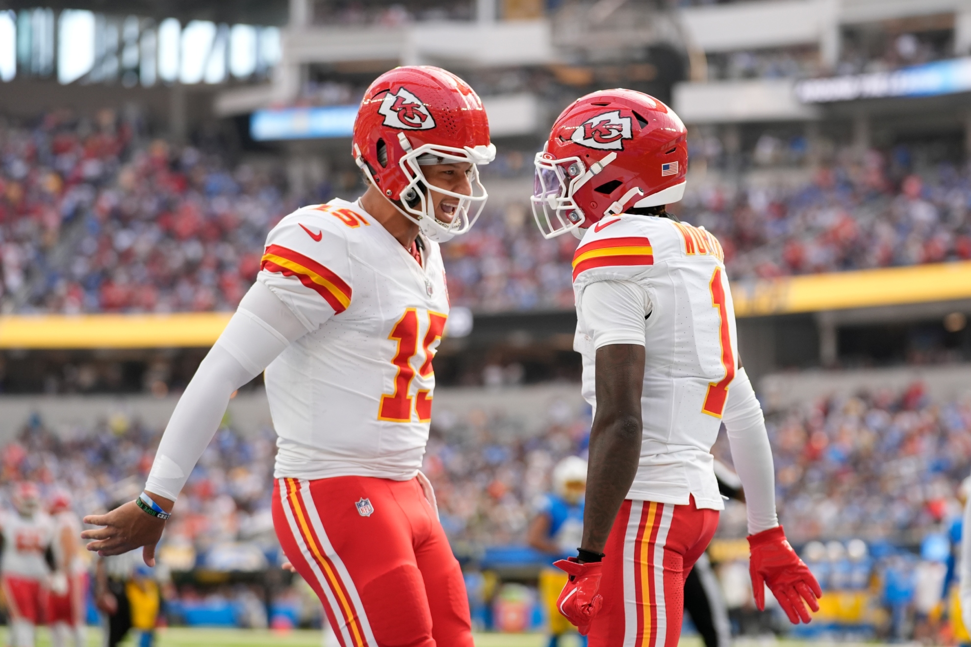 Kansas City Chiefs wide receiver Xavier Worthy, right, is celebrates after catching a 54-yard touchdown pass from teammate Patrick Mahomes