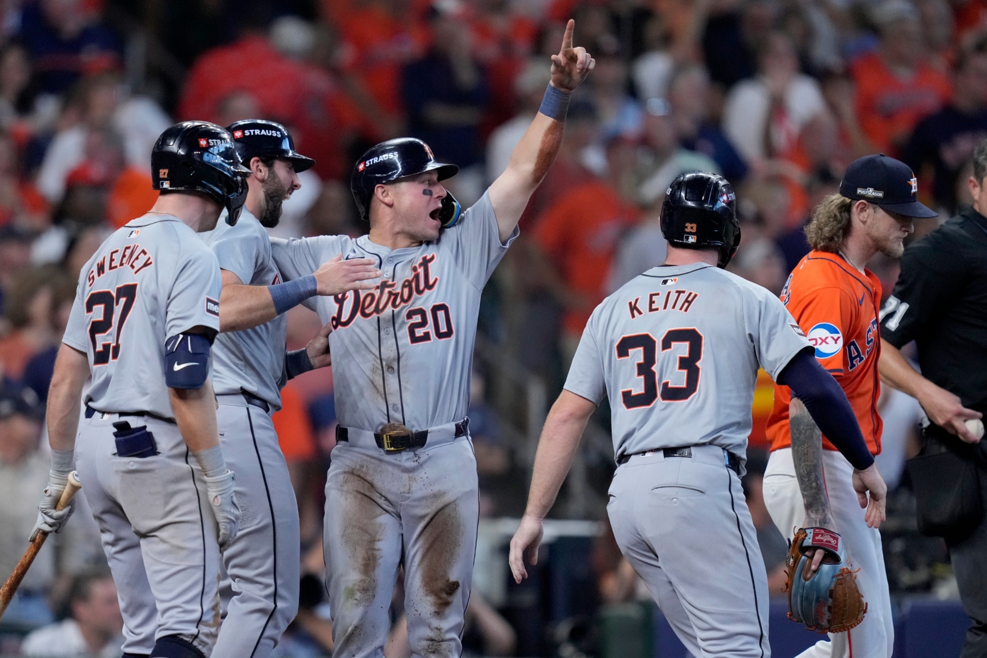 Detroit Tigers Trey Sweeney (27), Matt Vierling, left rear, Spencer Torkelson (20) and Colt Keith (33) celebrate after Torkelson, Keith and Vierling scored on a Andy Ibanez double as Houston Astros relief pitcher Josh Hader, right, walks past in the eighth inning of Game 2 of an AL Wild Card Series baseball game Wednesday, Oct. 2, 2024, in Houston. (AP Photo/Kevin M. Cox)