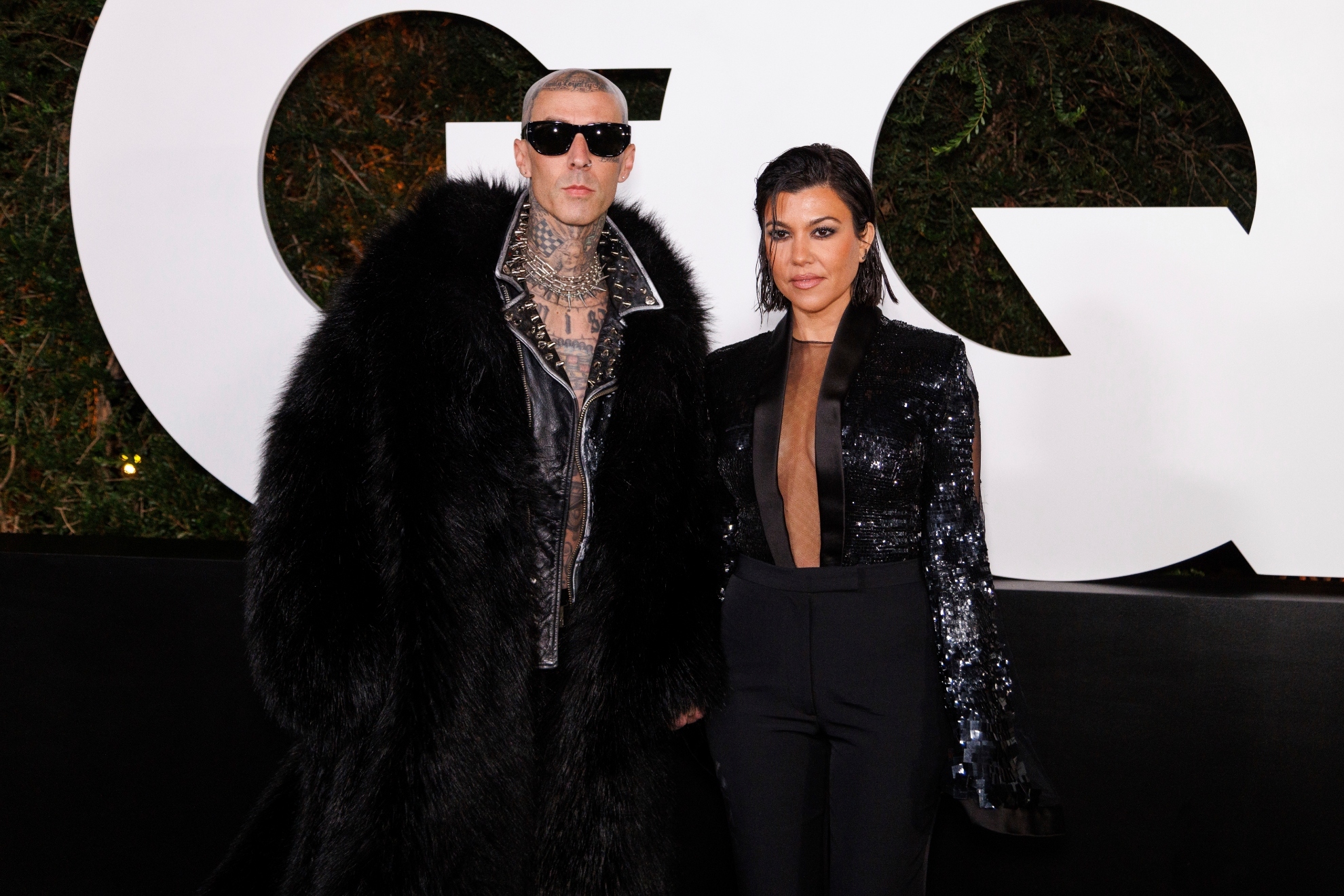 Travis Barker, left, and Kourtney Kardashian arrive at the 2022 GQ Men of the Year Party on Thursday, Nov. 17, 2022, at the West Hollywood Edition in West Hollywood, Calif.